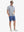 Full-body view of model holding takeaway drink cup in DARK BLUE HEATHER Cotton Blend Plain Shirt.