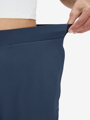 Detail view showing waist stretch on navy women's lightweight athletic sweatpants
