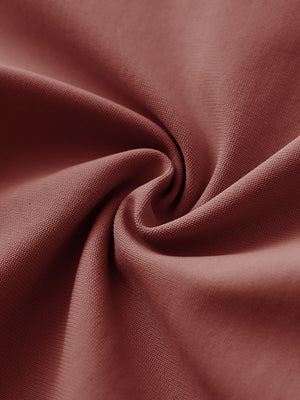 Texture close-up of Stretch plain everyday pants showing flexible fabric in cranberry