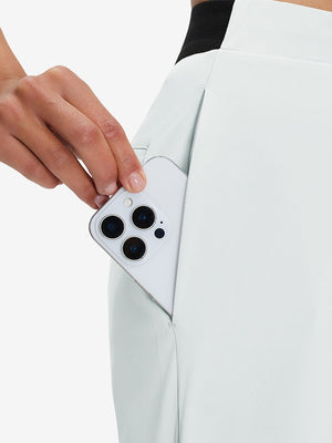 Side view of pocket on white women's lightweight athletic sweatpants