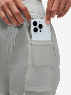 Inside view of pocket on glacier grey women's high waist 2 in 1 quick dry shorts with 7 pockets
