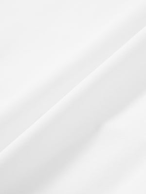 Close-up of white stretch quick dry casual golf pants with 4 pockets fabric texture.