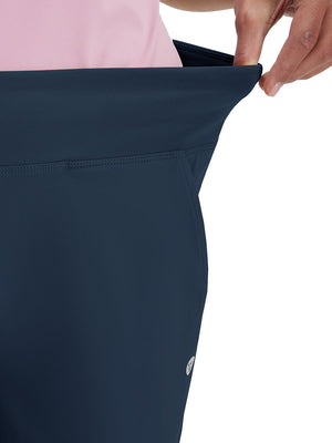 Detail view of waist stretch on navy women's high waist stretch golf pants with pockets