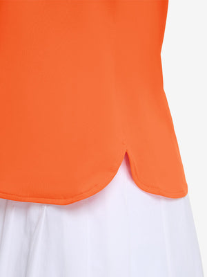 Detail view of hem on orange women's 5 buttons collared polo shirts