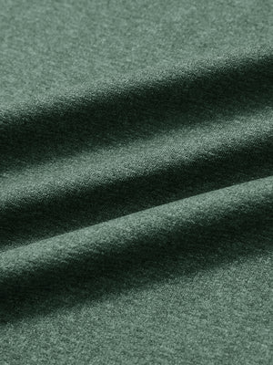 Close-up of classic heather pullover hoodies with 2 pocket fabric in dark green melange, soft knit texture
