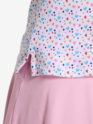 Detail view of hem on colorful hearts women's sleeveless q-zip print quick dry golf tops