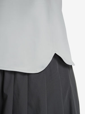 Detail view of hem on light grey women's 5 buttons collared polo shirts