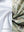 Close-up of the inner and outer fabric of youth full print stylish hoodies pullover in beryl green camo, showing texture and finish