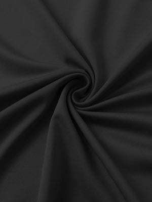 Close-up of black chest print polo shirt fabric showing smooth texture and crisp graphic application area.