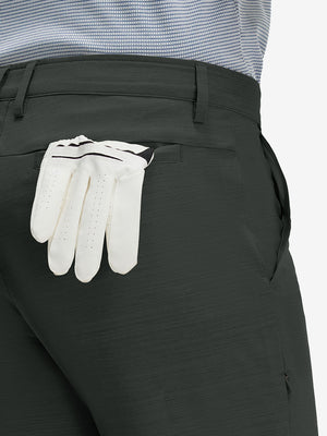 Detail view of back pocket on dark charcoal straight fit lightweight dress golf pants