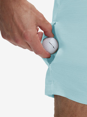 Detail view of stretch fabric on light blue flat front hybrid golf shorts