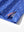 Close-up of the hem vent on the blue golf swing 4 way stretch print collared polo shirt, showing the side split for movement