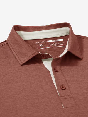 Collar and button detail close-up in red ochre heather of performance heather contrast collar polo shirts.