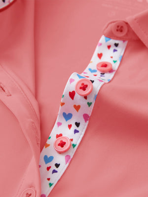 Detail view of collar and buttons on pink women's 5 buttons collared polo shirts