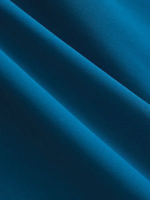 Close-up texture of blue cool print plain button up shirts fabric showing detailed print and weave.