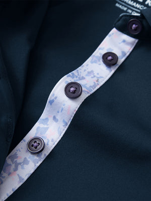 Detail view of collar and buttons on navy women's 5 buttons collared polo shirts