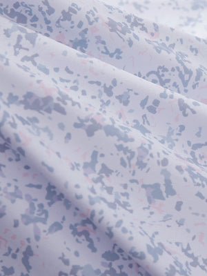 Close-up texture of pink purple rose women's sleeveless q-zip print quick dry golf tops fabric showing detailed print and quick dry weave.