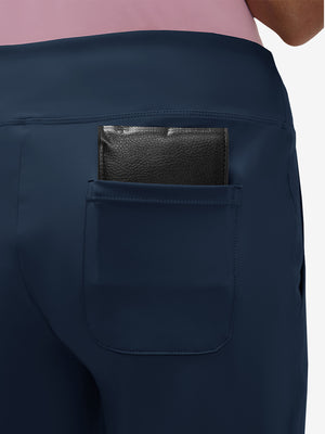 Back view of pocket on navy women's high waist stretch golf pants with pockets