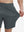 View showing loose fit of dark grey 4 way stretch breathable workout athletic shorts