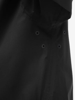 Detail view of underarm on black waterproof lightweight rain jacket with hood