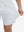 View showing loose fit of white 4 way stretch breathable workout athletic shorts