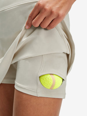 Detail view of inner pocket on oyster gray women's stretch a-line golf skort with 7 pockets