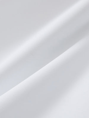 Close-up texture of white 4 way stretch breathable workout athletic shorts fabric showing weave detail.