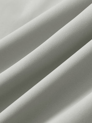 Close-up texture of silver gray 4 way stretch breathable workout athletic shorts fabric showing weave detail.