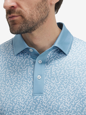 Front shot from nose to chest of model wearing white blue abstract stylish full print contrast collared golf polo shirts
