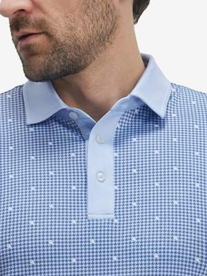 Front shot from nose to chest of model wearing light blue houndstooth stylish full print contrast collared golf polo shirts