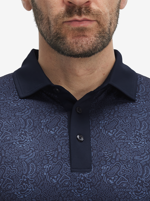 Front shot from nose to chest of model wearing navy graffiti stylish full print contrast collared golf polo shirts