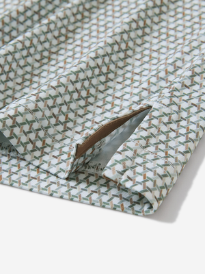 Detail view of hem on hexagon grid stylish full print contrast collared golf polo shirts