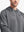 Front view from nose to chest of model wearing Classic Heather Fleece Hoodie in Neutral Grey Heather